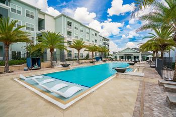 Inviting Pool & Sundeck With Sun Lounger Chairs & Cabanas